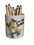 Pot à crayons en céramique de L'Atelier de Lolo, avec motif coloré et forme cylindrique.